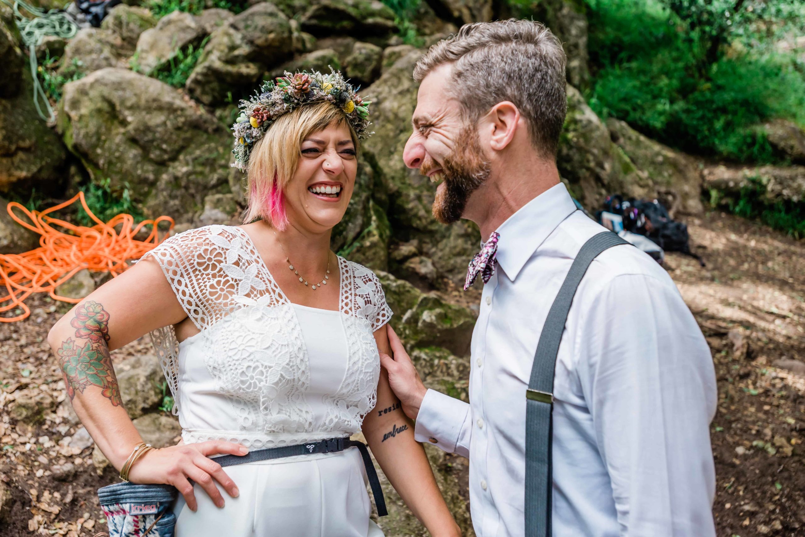 Couple shares a laugh at their adventurous rock climbing elopement experience. 