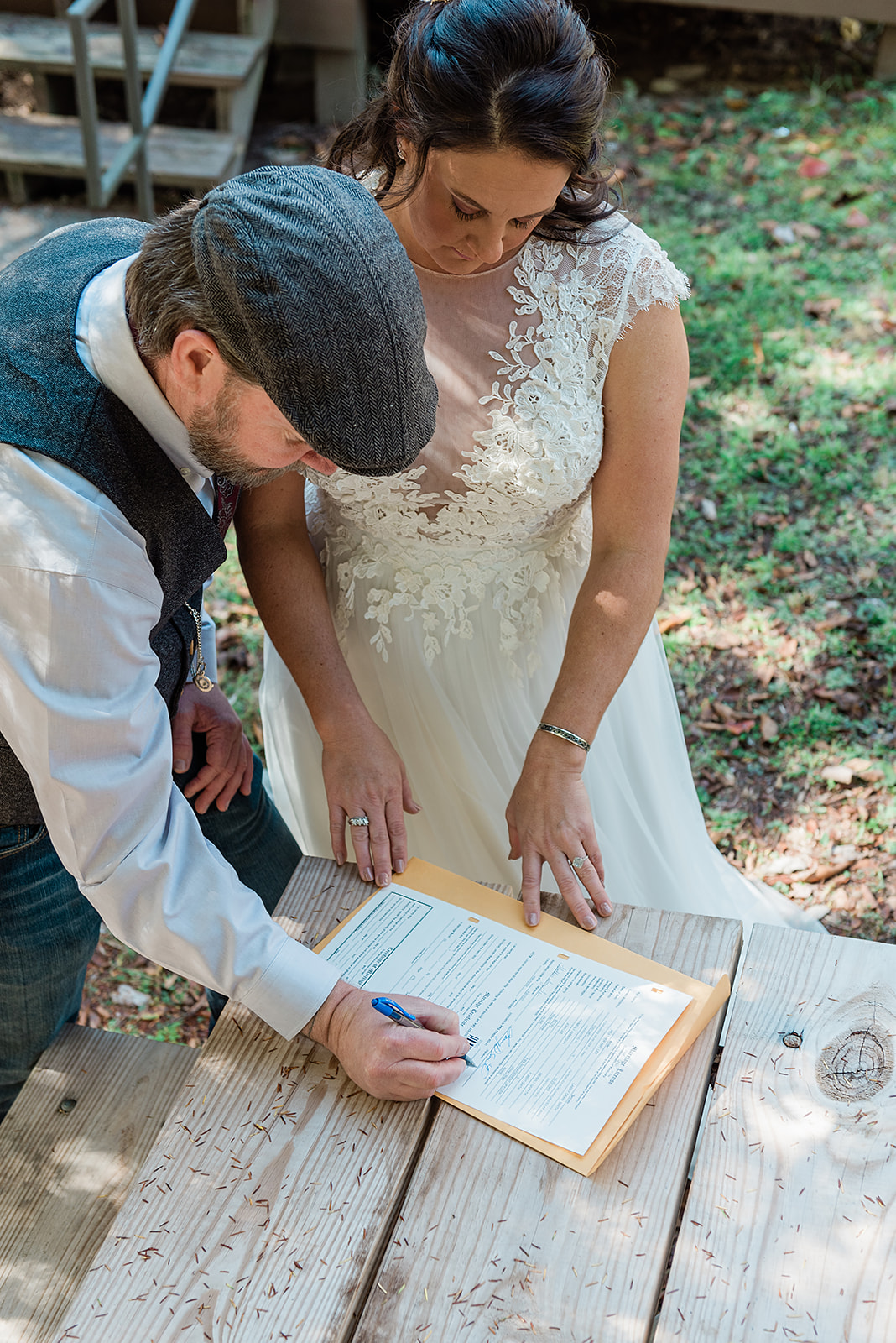 This picture is from my blog all about how to elope in Georgia. This is a picture of a bride and groom signing their marriage license.