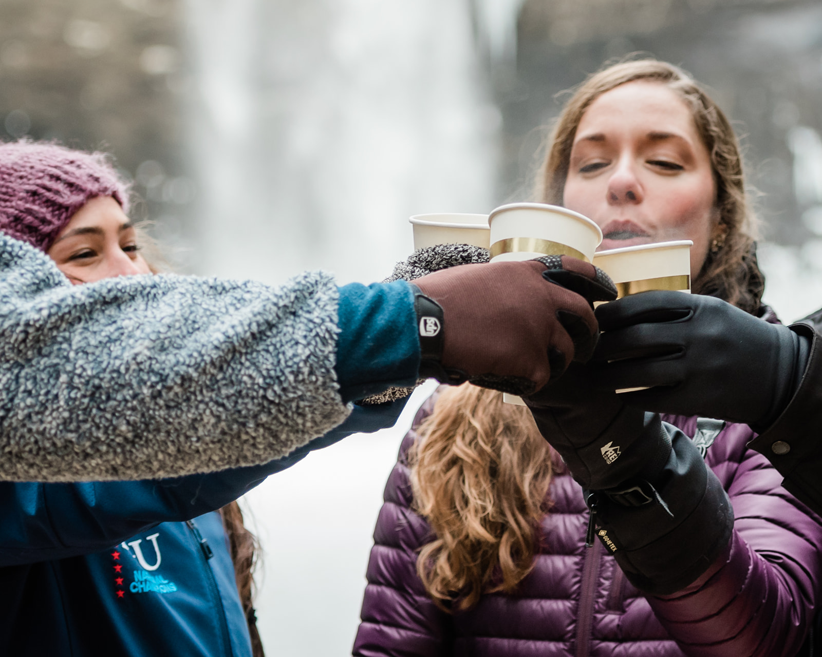 This is a picture of a couple cheering their warm drinks. They decided to elope in South Carolina and it was surprisingly cold and frozen.